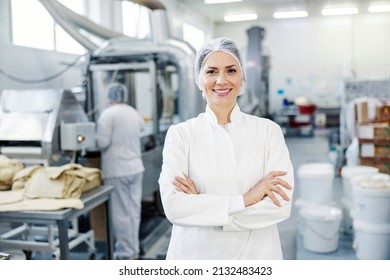 Portrait Of A Successful Female Food Plant Supervisor Smiling At The Camera.