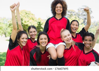 Portrait Of Successful Female Soccer Team At Park