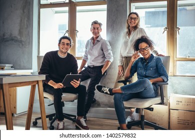 Portrait Of Successful Group Of People Working At Online Web Store. Men And Women At Ecommerce Business Office.