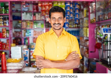 Portrait of successful Indian kirana or groceries businessman standing confidently with smile by looking at camera - concept of small business entrepreneur. - Shutterstock ID 2095760416