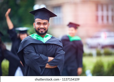 Portrait Of Successful Indian Student In Graduation Gown