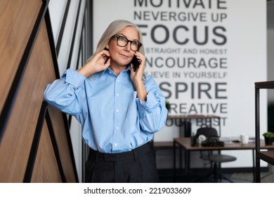 Portrait Of Successful Middle Aged Older Business Woman Executive With Mobile Phone In The Office, Concept Of Successful Business Development