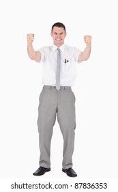 Portrait Of A Successful Salesperson With Fists Up Against A White Background