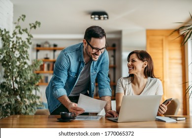 Portrait Of Successful Smiling Small Business Owners At Cozy Office.