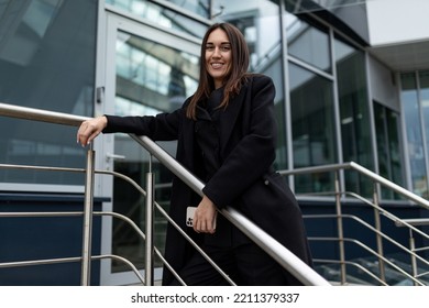 Portrait Of A Successful Strong Independent Woman Next To A Modern Building