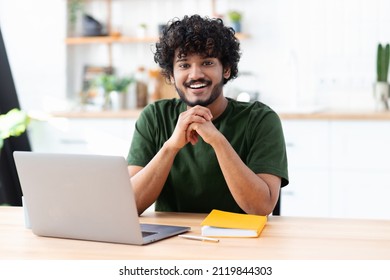 Portrait Of A Successful Young Indian Male Freelance Using Laptop And Looks At The Camera, Remote Work From Home, Online Education