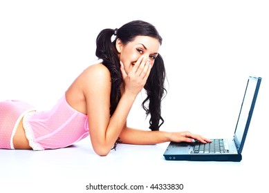 Portrait Of A Suprised Brunette Girl  On The Floor With A Laptop