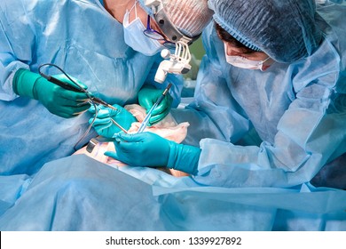 Portrait of a surgeon close-up. Surgeons operate on a patient. Tense, serious faces. Real operation. Tensioned atmosphere in the operating room. - Powered by Shutterstock