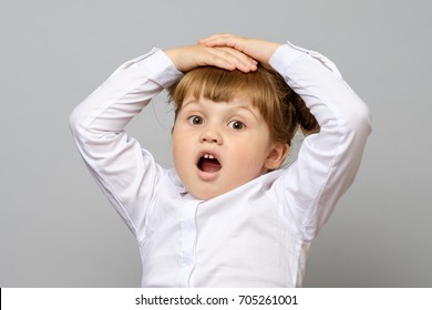 Portrait Of Surprised Little Girl Isolated