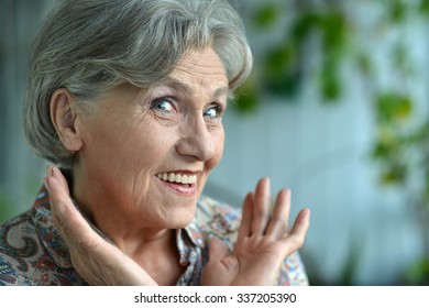 Portrait Of A Surprised Senior Woman Close-up