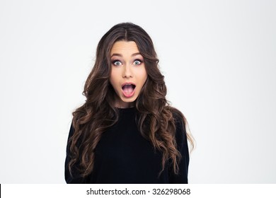Portrait of surprised woman with mouth open standing isolated on a white background
