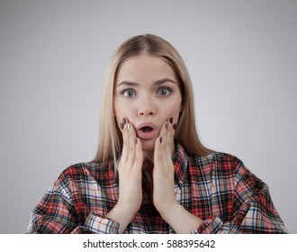 Portrait of a surprised young beautiful hipster blonde teenage, Isolated on white background - Shutterstock ID 588395642