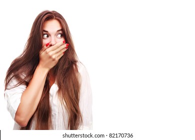 Portrait Of A Surprised Young Woman With Hands Over Her Mouth