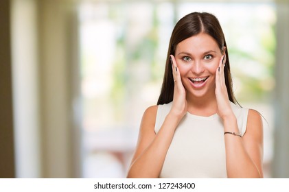 Portrait Of Surprised Young Woman At Her Home