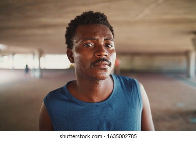Portrait of sweaty serious handsome young athletic African American man at outdoors looking to camera - Shutterstock ID 1635002785