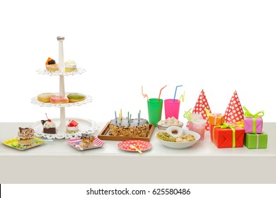 Portrait Of Table Set Up For Child's Party Isolated On White Background