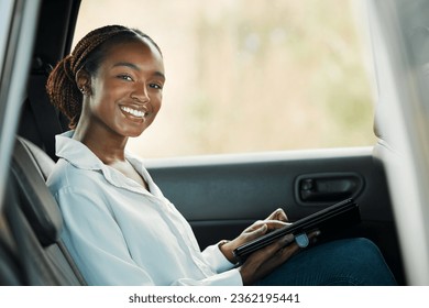 Portrait, tablet and a business black woman a taxi for transport or ride share on her commute to work. Smile, technology and a happy young employee in the backseat of a cab for travel as a passenger - Powered by Shutterstock