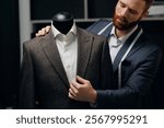 Portrait tailor working with suit to custom size for man, hand made fashion jacket, dark background.