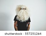 Portrait of tattooed brutal male weared blank black t-shirt and Santa