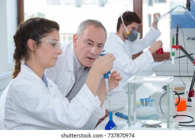 Portrait Of Teacher And Students In Biology Class