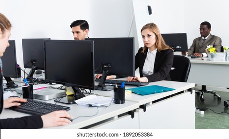 Portrait Of Team Of Positive Friendly Buisness People Working With Laptops In Office