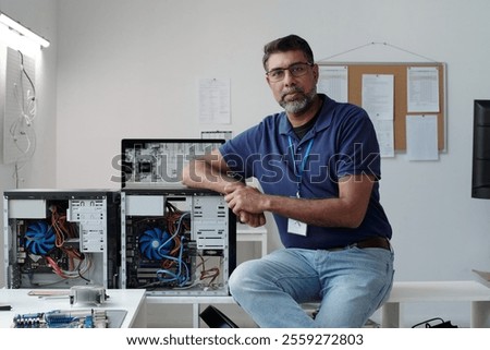 Portrait of Technician Demonstrating Computer Repairs