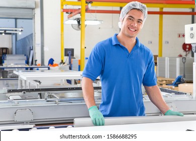 Portrait Of Technician Worker Smiling At Camera On Production Line Of Solar Panel Factory