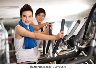 Portrait Of Teen Athletes Working Out In A Gym