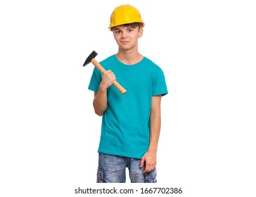 Portrait Of Teen Boy With Hammer, Wearing Yellow Hard Hat, Isolated On White Background. Cute Young Teenager With Tools, Looks Bewildered.