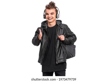 Portrait Of Teen Boy Student In Headphones With Spooking Make-up Holds Bag, Isolated On White Background. Teenager With Backpack In Style Of Punk Goth Dressed In Black. Problems Of Transitional Age