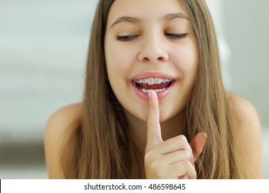 Portrait Of Teen Girl Showing Dental Braces.