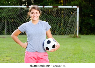 Portrait Of Teen Girl Soccer Player On Field