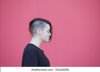 Portrait Of A Teen Lesbian Woman On A Pink Wall