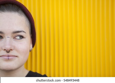 Portrait Of A Teen Lesbian Woman On A Yellow Wall