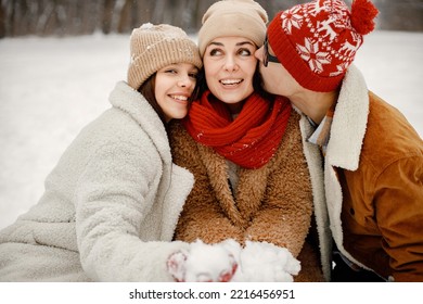 Portrait Of Teen Siblings And Their Mother At Winter Park