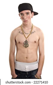 Portrait Of A Teen Youth With Top Off Showing Tattoos And Bling With Trousers Pulled Low