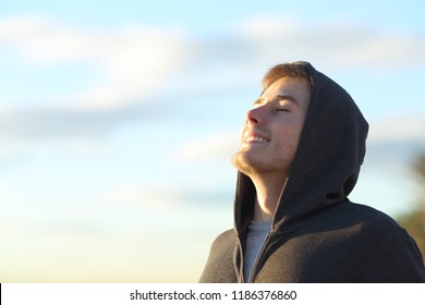 Portrait Of A Teenage Boy Breathing Deep Fresh Air