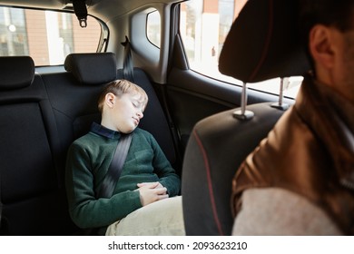 Portrait Of Teenage Boy Sleeping In Back Seat Of Family Car, Copy Space