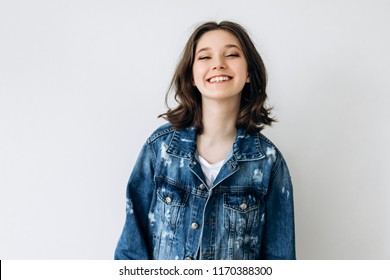 Portrait Of A Teenage Girl 12-14 Years Old On A White Background.