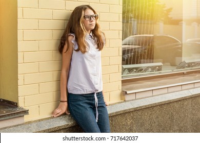 Portrait Of A Teenage Girl 13-14 Years Old.