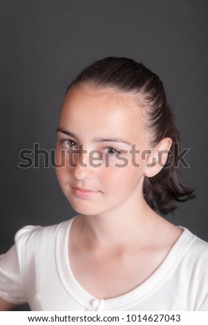 Similar – Adorable preteen girl with plants of background