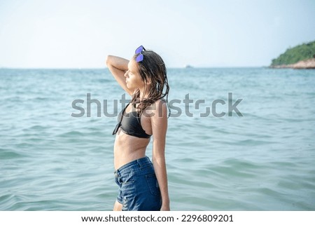 Portrait of teenage girl having fun on vacation on beach,Vacation beach carefree relax concept.
