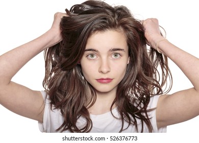 Portrait Of A Teenage Girl Who Is Pulling Her Hair Out