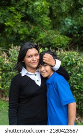 Portrait Of Teenage Siblings Standing In Park