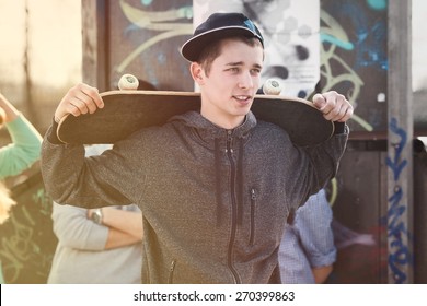 Portrait of teenage skater boy with a skateboard  - Powered by Shutterstock