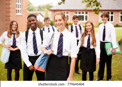 Portrait Of Teenage Students In Uniform Outside School Buildings - Shutterstock ID 779645404