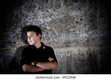 Portrait Of Teenager Against In Profile Against Concrete Wall High Contrast Checkout More Of Same Model