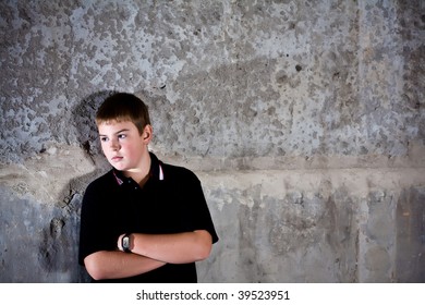 Portrait Of Teenager Against In Profile Against Concrete Wall High Contrast Checkout More Of Same Model