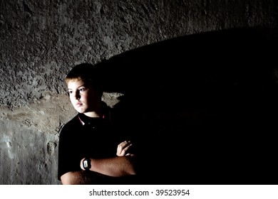 Portrait Of Teenager Against In Profile Against Concrete Wall High Contrast Checkout More Of Same Model