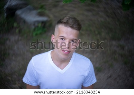 Similar – Image, Stock Photo Stylish teenager sitting on a wooden bench